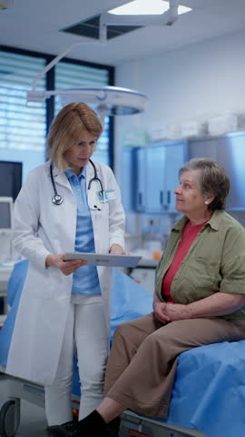 Geriatrician explaining test results to senior patient during check-up.