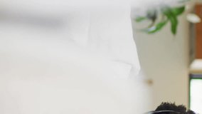 Relaxing on couch, man viewing animation of social media notifications. Technology, relaxation, leisure, digital, connectivity, living room - Powered by Shutterstock - Get 15% off with code: PIKWIZARD15