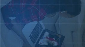 Animation of graph and covid 19 virus cells over woman using laptop. global covid 19 pandemic concept digitally generated video. - Powered by Shutterstock - Get 15% off with code: PIKWIZARD15