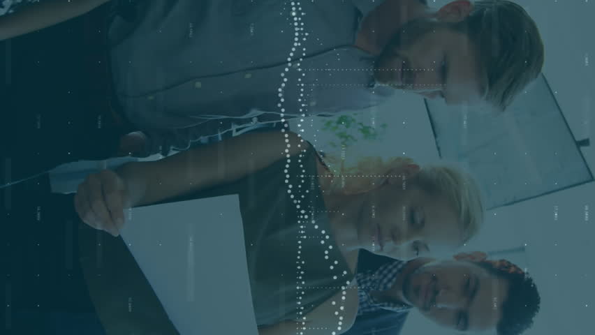 Animation of data processing over diverse team of colleagues reading documents together at office. Global economy and business technology concept - Powered by Shutterstock - Get 15% off with code: PIKWIZARD15