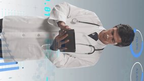 Animation of financial data and graphs over caucasian male doctor. Health, medicine, finance and technology concept digitally generated video. - Powered by Shutterstock - Get 15% off with code: PIKWIZARD15