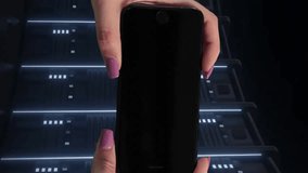 Holding smartphone with circuit board animation, person standing in server room. Technology, innovation, data, cybersecurity, electronics, networking - Powered by Shutterstock - Get 15% off with code: PIKWIZARD15