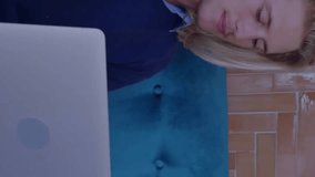 Animation of profile icon in circles over caucasian man sitting on sofa and working on laptop. Digital composite, multiple exposure, business, shape, abstract and technology concept. - Powered by Shutterstock - Get 15% off with code: PIKWIZARD15