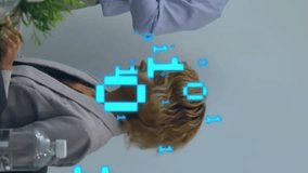 Animation of binary coding data processing over diverse business people in office. Global business, finance, connections, computing and data processing concept digitally generated video. - Powered by Shutterstock - Get 15% off with code: PIKWIZARD15