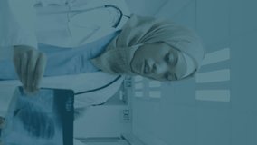 Animation of financial graphs and data over diverse female doctors with x ray photo. health, medical profession, economy, finance and technology concept digitally generated video. - Powered by Shutterstock - Get 15% off with code: PIKWIZARD15