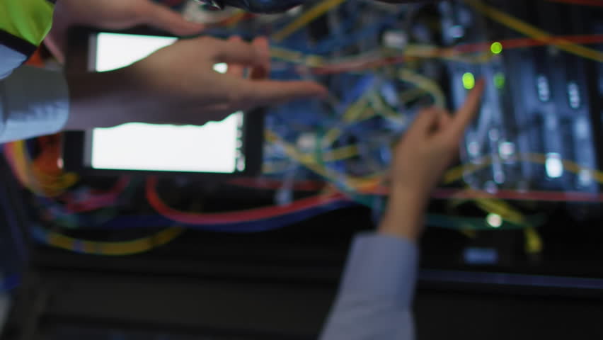 Animation of nft texts over diverse workers in server room. global business and digital interface concept digitally generated video. - Powered by Shutterstock - Get 15% off with code: PIKWIZARD15