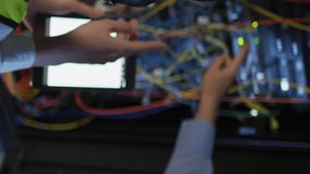 Animation of nft texts over diverse workers in server room. global business and digital interface concept digitally generated video. - Powered by Shutterstock - Get 15% off with code: PIKWIZARD15