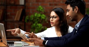 business people using laptop and smartphone in office for project discussion, Indian Asian corporate man woman in professional attire collaborating with digital devices in cozy workplace - Powered by Shutterstock - Get 15% off with code: PIKWIZARD15