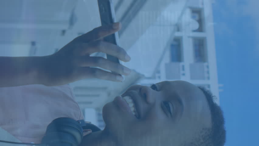 Animation of digital data processing over african american woman using smartphone. Global connections, data processing and digital interface concept digitally generated video. - Powered by Shutterstock - Get 15% off with code: PIKWIZARD15