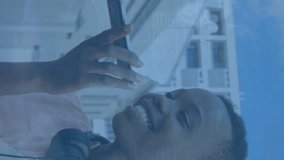 Animation of digital data processing over african american woman using smartphone. Global connections, data processing and digital interface concept digitally generated video. - Powered by Shutterstock - Get 15% off with code: PIKWIZARD15