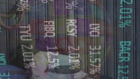 Animation of financial data processing over woman wearing face mask. Global covid 19, computing, finance, business and data processing concept digitally generated video. - Powered by Shutterstock - Get 15% off with code: PIKWIZARD15