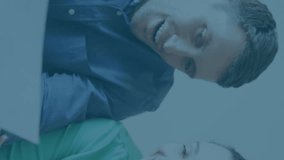 Animation of stock market data processing over caucasian couple calculating finances at home. Family budget and expenses concept - Powered by Shutterstock - Get 15% off with code: PIKWIZARD15