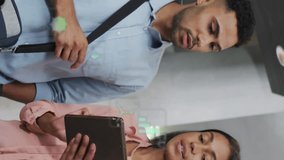 Animation of icons and changing numbers over diverse coworkers discussing reports on digital tablet. Digital composite, multiple exposure, hazardous, recycling, planning, teamwork and technology. - Powered by Shutterstock - Get 15% off with code: PIKWIZARD15