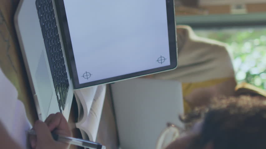 Animation of data processing, 6g icons over caucasian girl writing by laptop at desk. Digital composite, multiple exposure, education, speed, modern, e-learning, internet, technology. - Powered by Shutterstock - Get 15% off with code: PIKWIZARD15