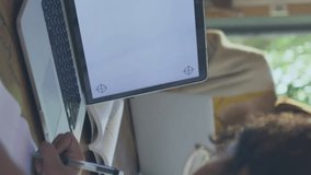 Animation of data processing, 6g icons over caucasian girl writing by laptop at desk. Digital composite, multiple exposure, education, speed, modern, e-learning, internet, technology. - Powered by Shutterstock - Get 15% off with code: PIKWIZARD15