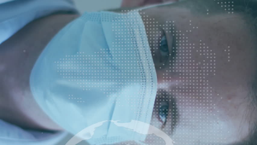 Animation of globe and world map over caucasian male doctor with face mask. Global medicine and digital interface concept digitally generated video. - Powered by Shutterstock - Get 15% off with code: PIKWIZARD15
