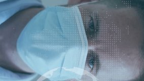 Animation of globe and world map over caucasian male doctor with face mask. Global medicine and digital interface concept digitally generated video. - Powered by Shutterstock - Get 15% off with code: PIKWIZARD15