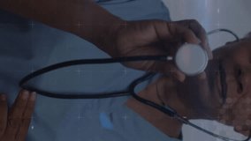 Animation of medical icons over african american female senior doctor holding a stethoscope. Medical research and healthcare technology concept - Powered by Shutterstock - Get 15% off with code: PIKWIZARD15