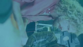 Animation of flowchart of icons over diverse designers discussing about clothes design in office. Digital composite, multiple exposure, communication, ideas, teamwork and technology concept. - Powered by Shutterstock - Get 15% off with code: PIKWIZARD15