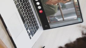 Animation of financial data processing over diverse business people on laptop video call. Global finance, business, connections, computing and data processing concept digitally generated video. - Powered by Shutterstock - Get 15% off with code: PIKWIZARD15