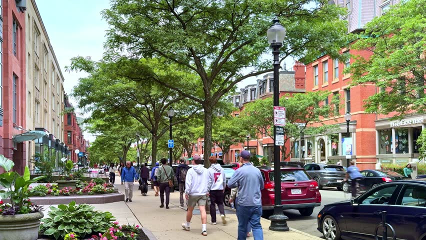 Boston, MA, USA - July 10, 2025: view of the architecture of the iconic Newbury street in Boston with its expensive stores, fancy restaurants and lots of locals and tourists passing by.