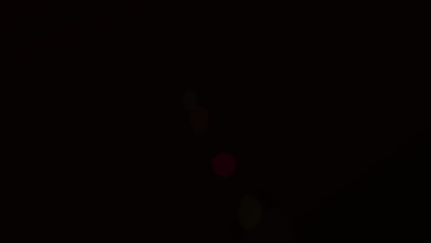 Animation of glowing red spots of light lens flare moving in hypnotic motion in seamless loop on black background. Light colour and movement concept digitally generated image. - Powered by Shutterstock - Get 15% off with code: PIKWIZARD15