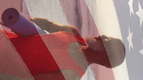 Animation of flag of usa over senior african american man with yoga mat on beach. American patriotism, nationality, summer and diversity concept digitally generated video. - Powered by Shutterstock - Get 15% off with code: PIKWIZARD15