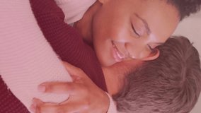 Animation of hearts and light spots over diverse couple embracing in kitchen. Lifestyle, relationships and domestic life concept digitally generated video. - Powered by Shutterstock - Get 15% off with code: PIKWIZARD15