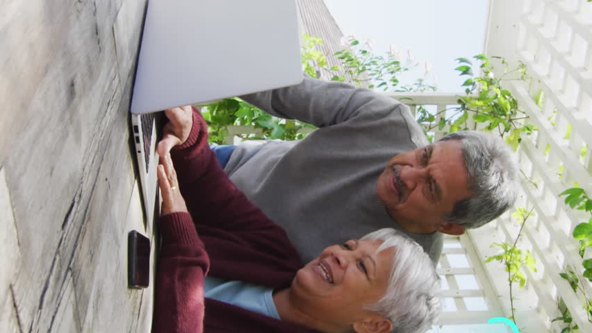 Animation of networks of connections spinning over senior couple using laptop at home. global networking, connection and communication concept digitally generated video. - Powered by Shutterstock - Get 15% off with code: PIKWIZARD15