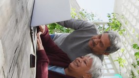 Animation of networks of connections spinning over senior couple using laptop at home. global networking, connection and communication concept digitally generated video. - Powered by Shutterstock - Get 15% off with code: PIKWIZARD15