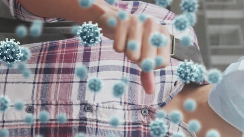 Animation of virus cells and biohazard sign over caucasian man wearing face mask and coughing. global covid 19 pandemic and health concept digitally generated video. - Powered by Shutterstock - Get 15% off with code: PIKWIZARD15