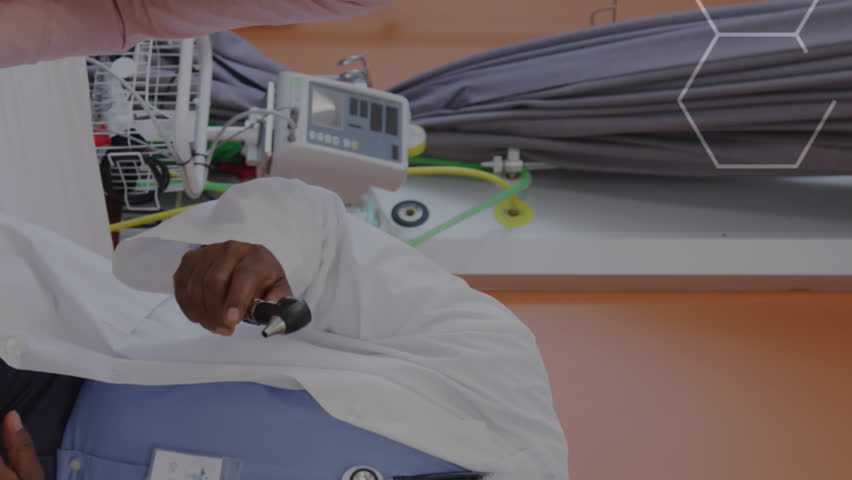 Animation of dna strand over african american male doctor with female patient. Global medicine, healthcare, digital interface, computing and data processing concept digitally generated video. - Powered by Shutterstock - Get 15% off with code: PIKWIZARD15