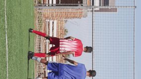 Animation of media icons over diverse male soccer players playing match. Global sport and digital interface concept digitally generated video. - Powered by Shutterstock - Get 15% off with code: PIKWIZARD15