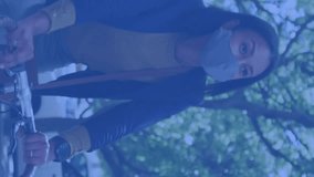 Animation of social media notifications over woman in face mask riding bicycle. Global communication network during coronavirus and social media interface concept digitally generated video. - Powered by Shutterstock - Get 15% off with code: PIKWIZARD15