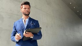 Successful handsome businessman wearing blue suit and sunglasses checking time and look far - Powered by Shutterstock - Get 15% off with code: PIKWIZARD15