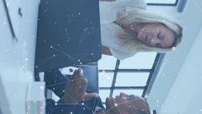 Animation of financial data processing over diverse business people in office. Global finance, business, connections, computing and data processing concept digitally generated video. - Powered by Shutterstock - Get 15% off with code: PIKWIZARD15