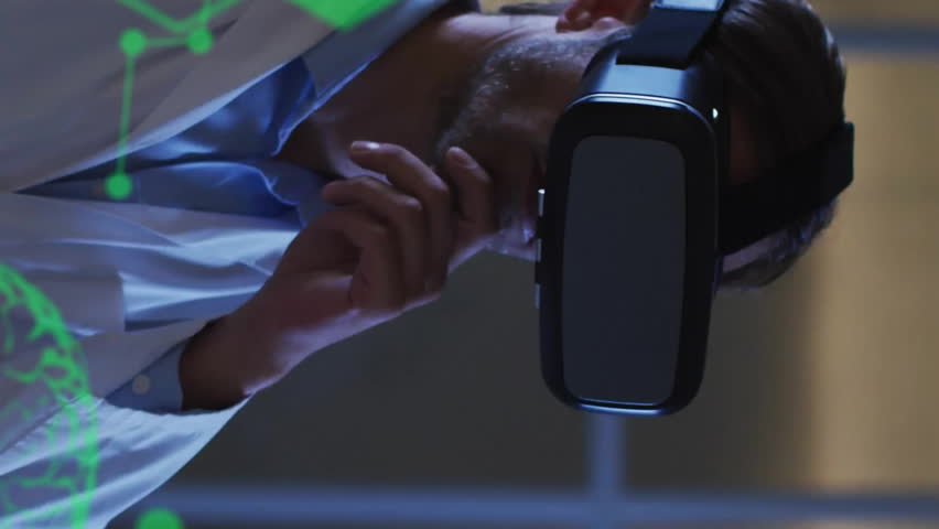 Animation of data processing with brains and molecules over caucasian male doctor using vr headset. Global medicine, healthcare, science and digital interface concept digitally generated video. - Powered by Shutterstock - Get 15% off with code: PIKWIZARD15