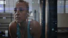 Female athlete leaning on bag after boxing for fitness recovery while tracking animated overlays. Fitness, determination, strength, resilience, endurance, sport, commercial - Powered by Shutterstock - Get 15% off with code: PIKWIZARD15
