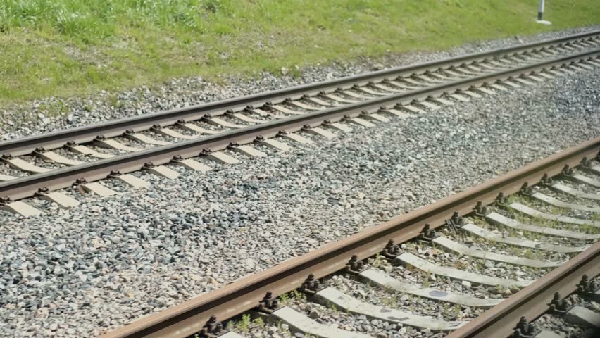 view from the train window on the railway tracks