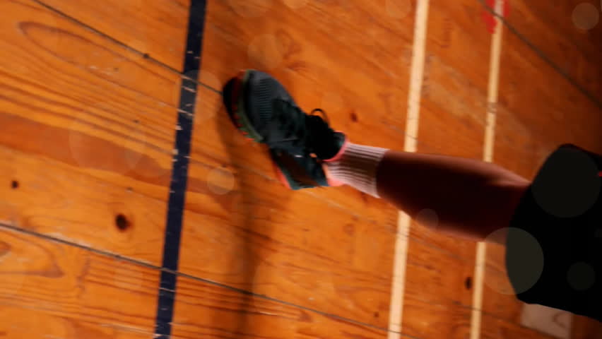 Animation of caucasian basketball player stretching and spots of light on black background. Sports, competition and movement concept digitally generated image. - Powered by Shutterstock - Get 15% off with code: PIKWIZARD15