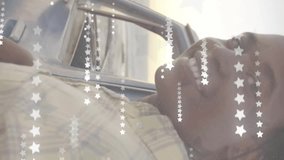 Animation of american flag and stars over happy african american man by car on sunny beach. Vacations, road trip, american, patriotism, celebration and tradition, digitally generated video. - Powered by Shutterstock - Get 15% off with code: PIKWIZARD15