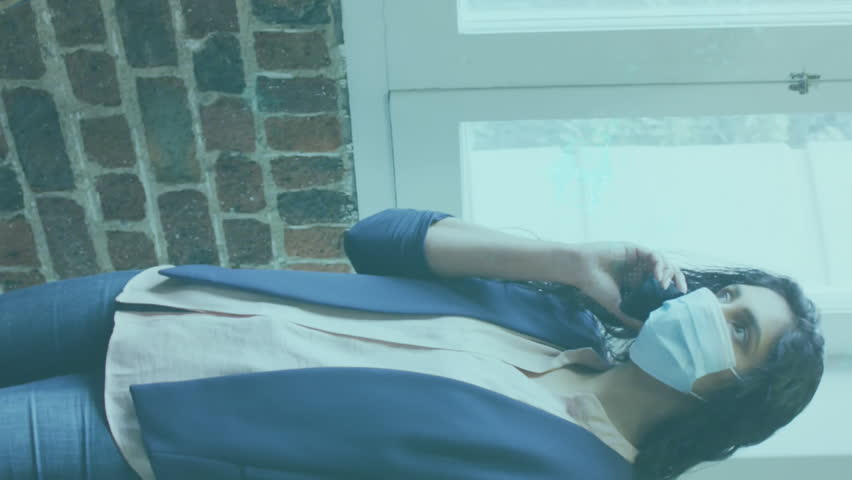 Animation of glowing light over businessman using technology. global networks, business and connections concept during covid 19 pandemic digitally generated video. - Powered by Shutterstock - Get 15% off with code: PIKWIZARD15