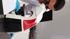 Animation of scientific data processing over male scientist using microscope in laboratory. Global business digital interface technology and networking concept digitally generated video. - Powered by Shutterstock - Get 15% off with code: PIKWIZARD15