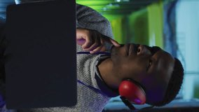 Animation of social media icons over african american male engineer using laptop at server room. Social media networking and business data storage technology concept - Powered by Shutterstock - Get 15% off with code: PIKWIZARD15