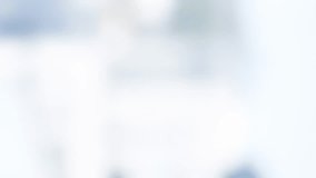 Animation of golden house keys against blurred view of tall buildings. Relocation and real estate concept - Powered by Shutterstock - Get 15% off with code: PIKWIZARD15