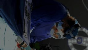 Animation of cardiograph over diverse surgeons during operation. Technology, medicine and digital interface concept digitally generated video. - Powered by Shutterstock - Get 15% off with code: PIKWIZARD15