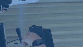 Animation of bright light spot over caucasian waitress wearing face mask serving coffee at a cafe. Global business and technology concept - Powered by Shutterstock - Get 15% off with code: PIKWIZARD15