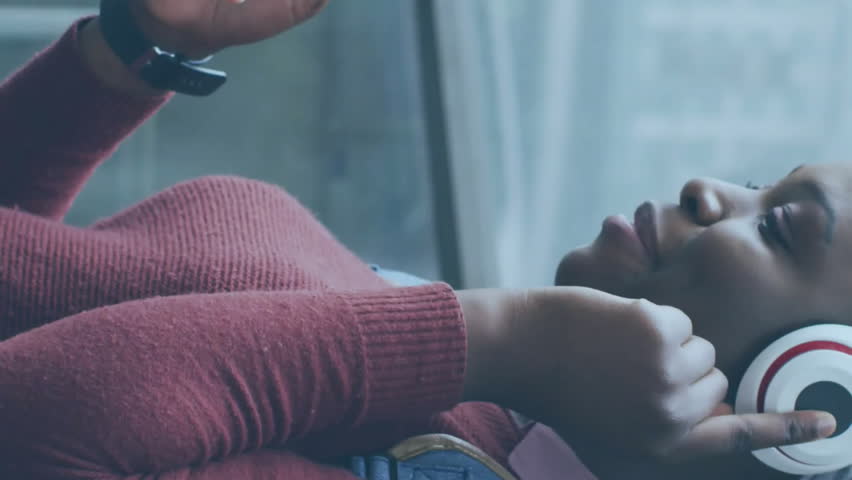 Animation of icons and data processing over african american woman using smartphone. Global social media, connections, computing and data processing concept digitally generated video. - Powered by Shutterstock - Get 15% off with code: PIKWIZARD15