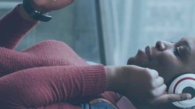 Animation of icons and data processing over african american woman using smartphone. Global social media, connections, computing and data processing concept digitally generated video. - Powered by Shutterstock - Get 15% off with code: PIKWIZARD15