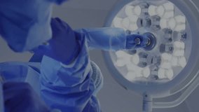 Animation of data processing over diverse surgeons during operation. Technology, medicine and digital interface concept digitally generated video. - Powered by Shutterstock - Get 15% off with code: PIKWIZARD15
